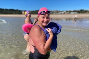 Sally Minty-Gravett emerging from the sea after swimming